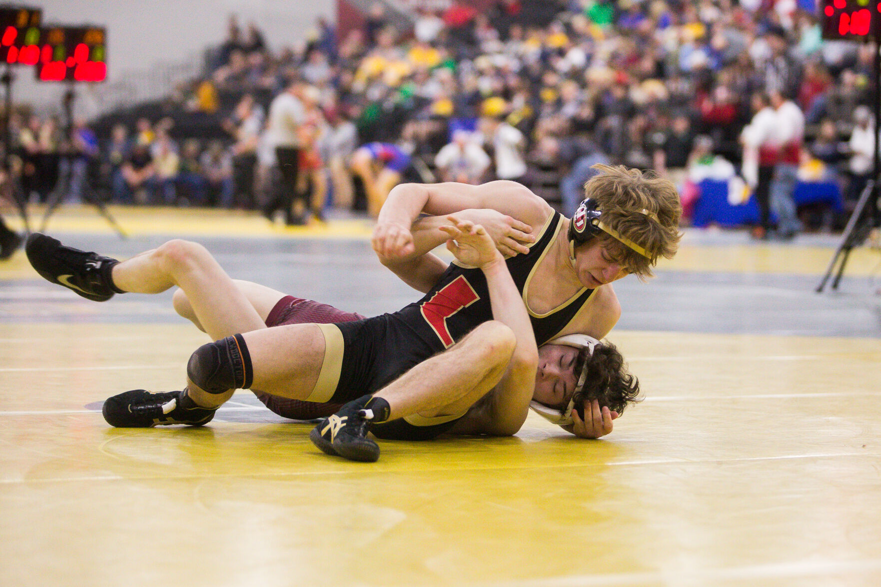University sits 4 points back in team standings after day 1 of state wrestling tournament